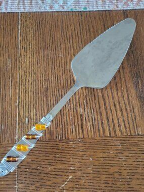 Cake server. Fall colored. Stainless steel